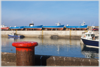 Blue boats out the water at Seahouses.