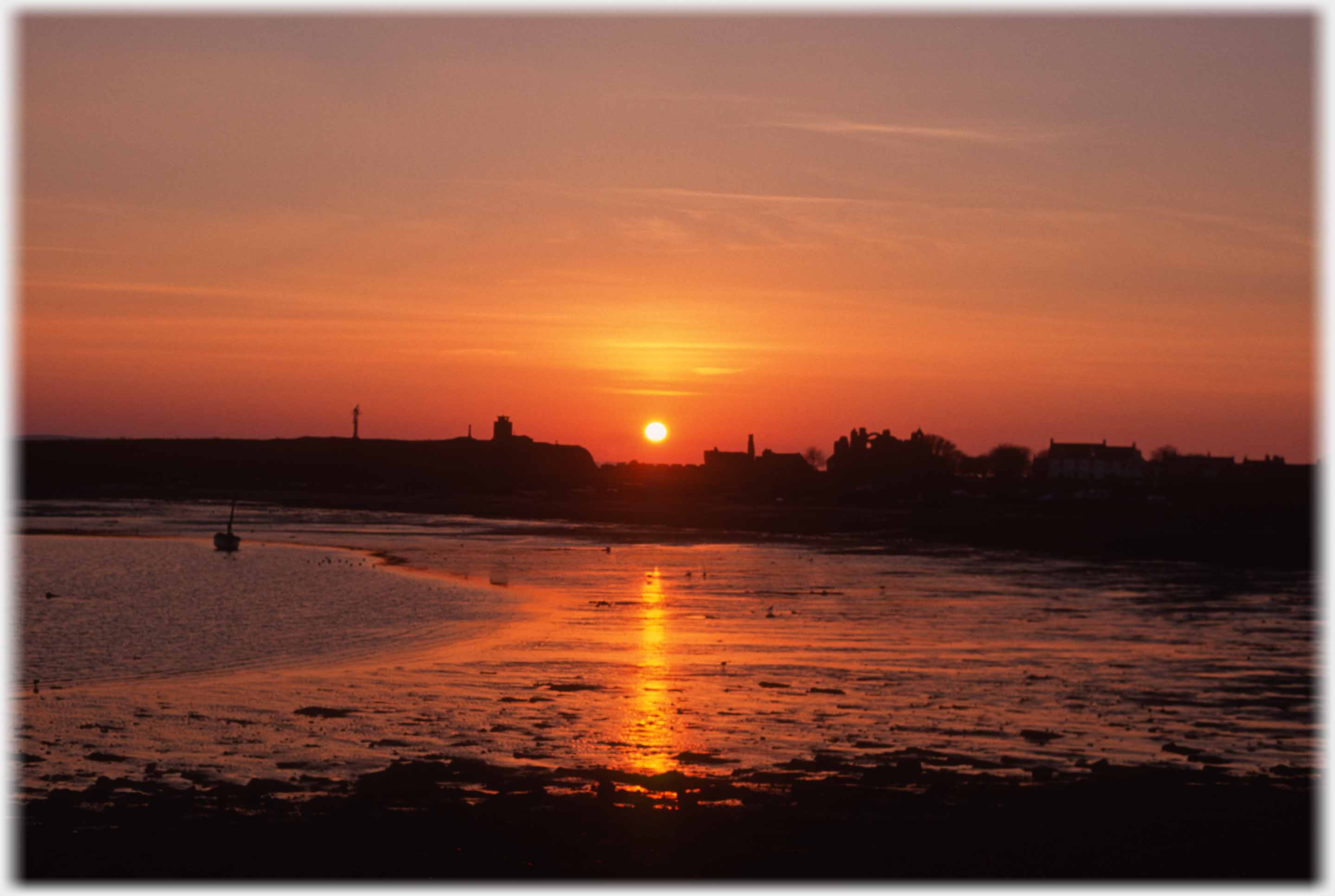 View across the Ouse towards priory with setting sun.