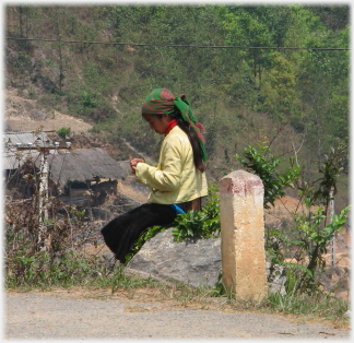 Woman in yellow sitting.