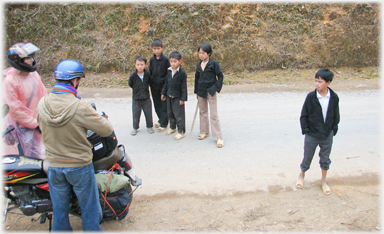 Boys gathering to inspect westerners.