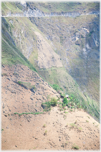 The road cuts into the hillside.