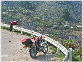 Photographer and parked motorbike.