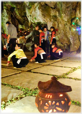 Incised clay lantern and squatting dancers.