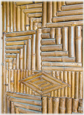 Bamboo cut into short sections and mounted in panels to make patterns.