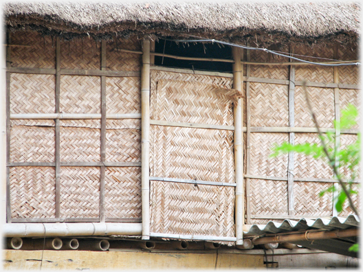 Wall panels patterned by the weave of leaves.