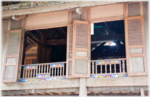 Two windows with balastrade and painted details.