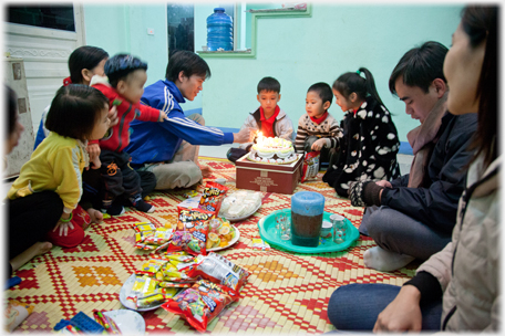 Birthday party with cake and candles.