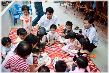 Birthday party on cafe floor.