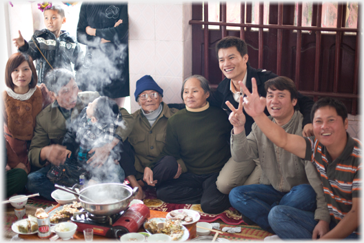 Four generations sit down together.