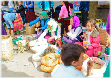 Women selling from sacks of dry goods.