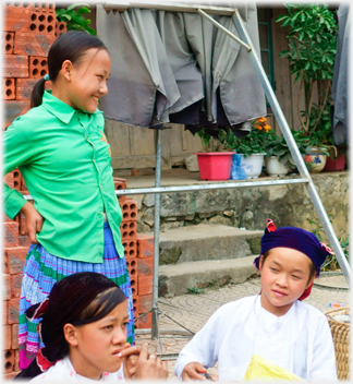 Girl standing laughing.