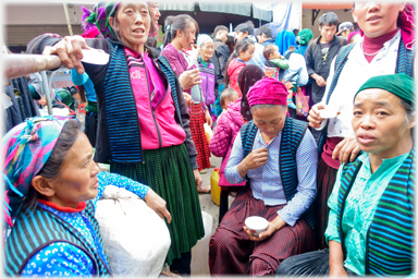 Women drinking together.