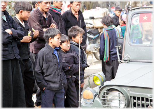 Boys looking at the Jeep.