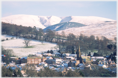 St Mary's Church, academy and Swatte Fell in snow.