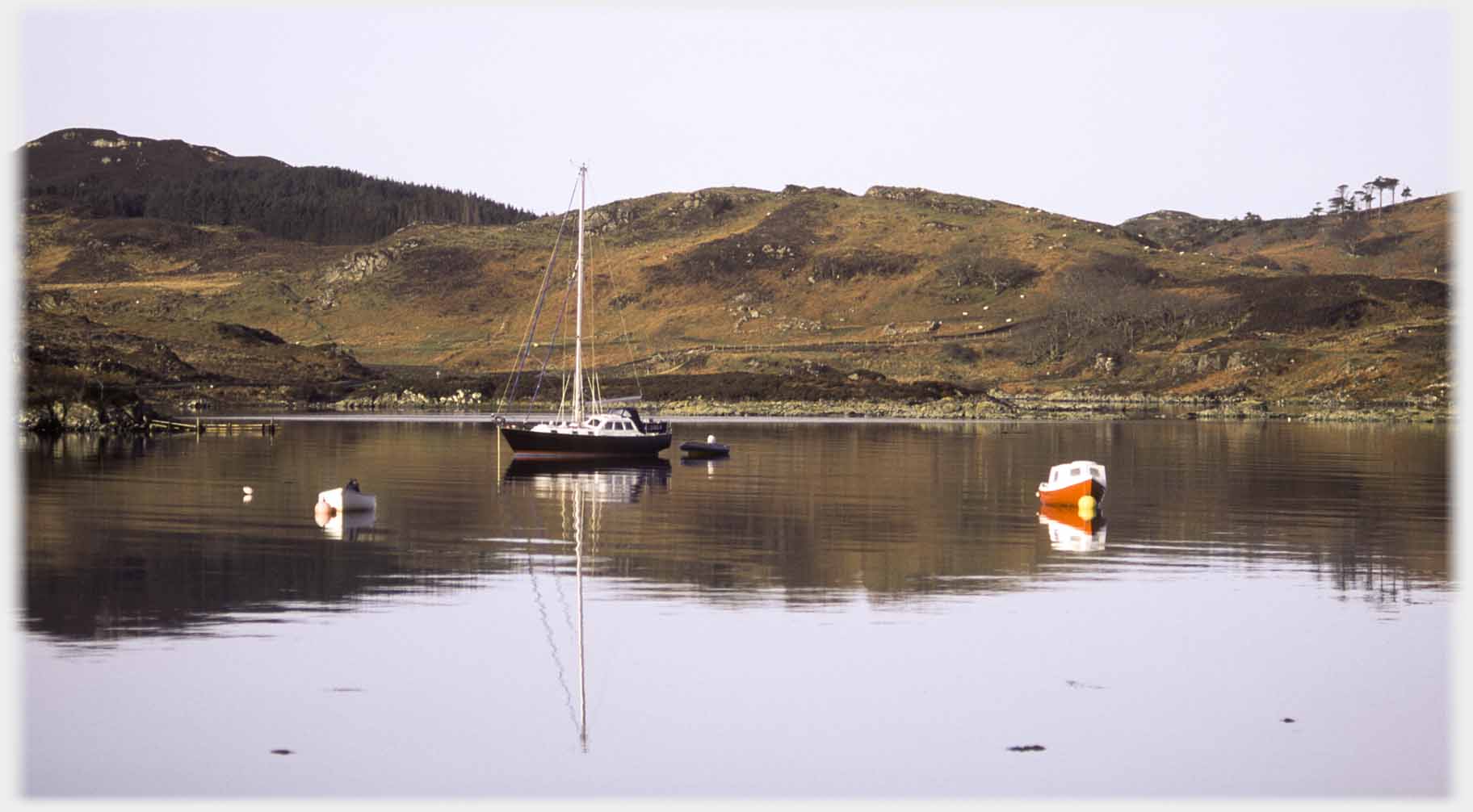 Sailing boat in quiet water.