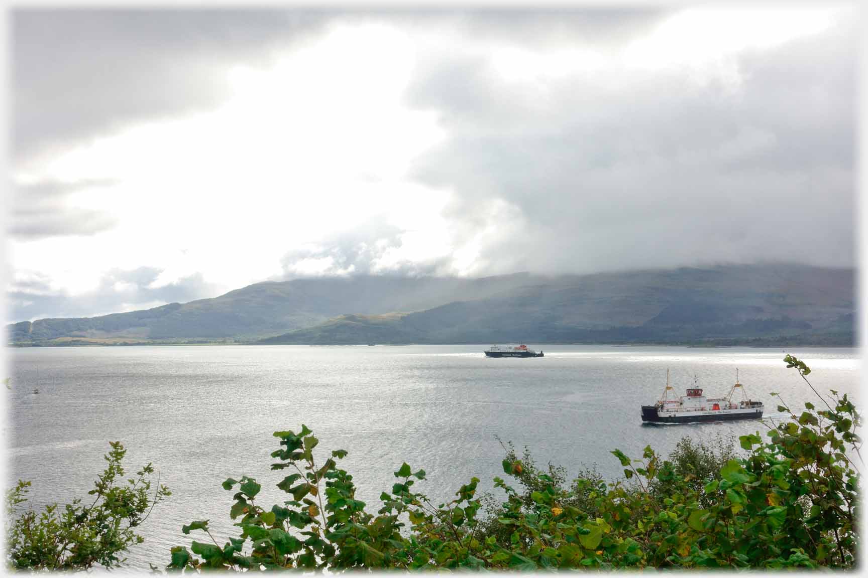 Two steamers on wide waterway.