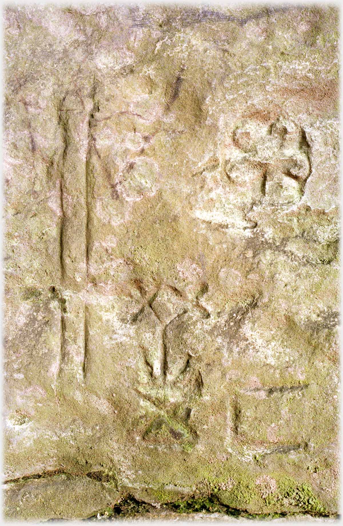 Carvings on stone including Greek crosses.