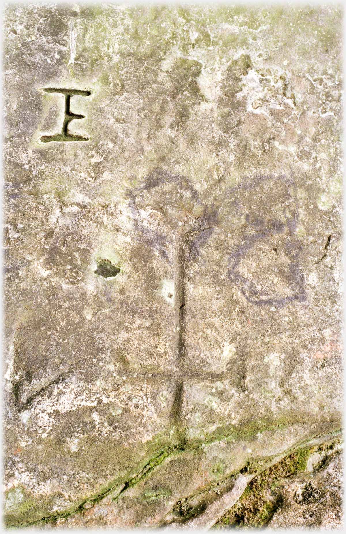 Carvings on stone including crosses.