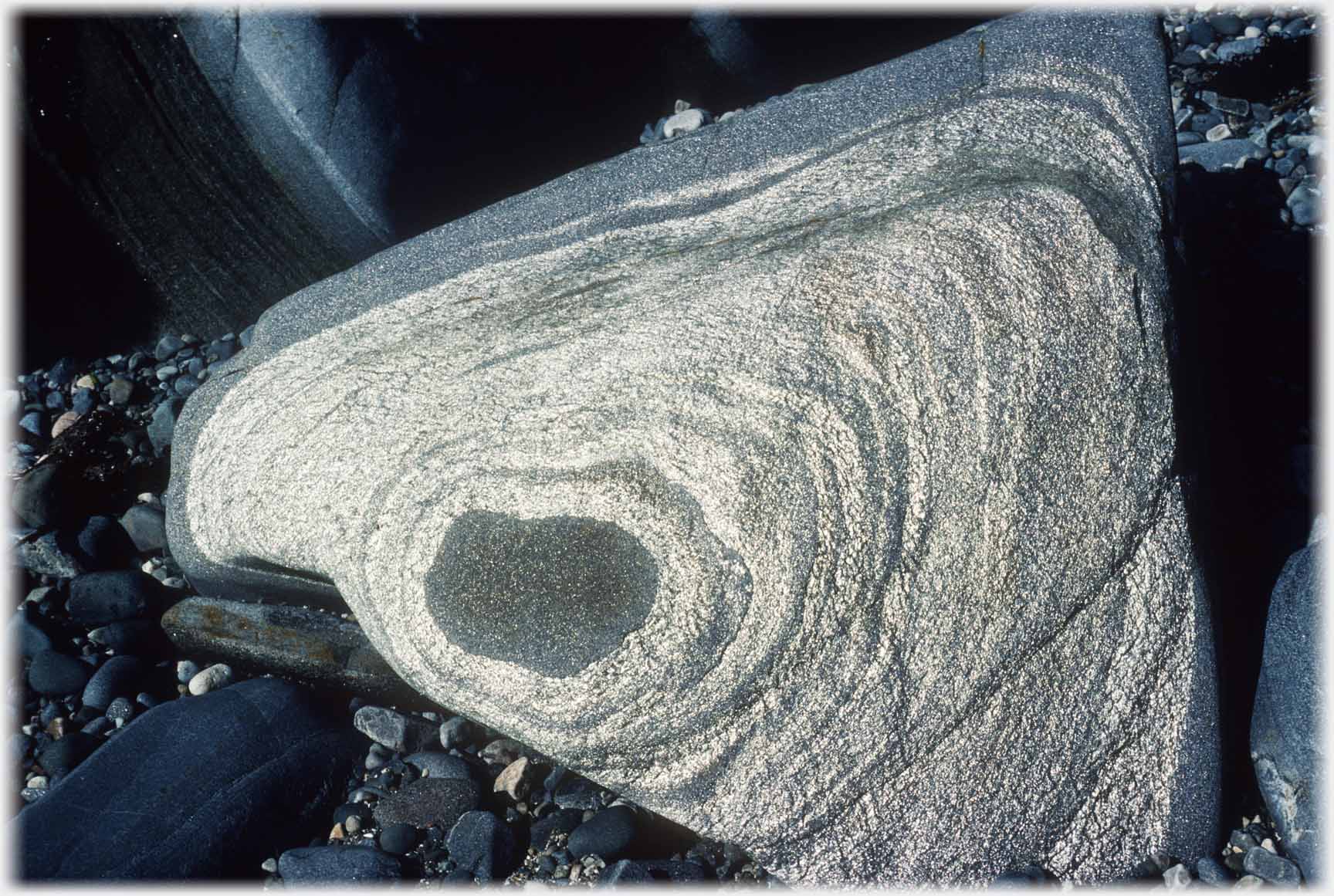 Glinting silver patterns on a rock.