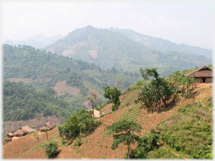 Wooded hillsides and houses.