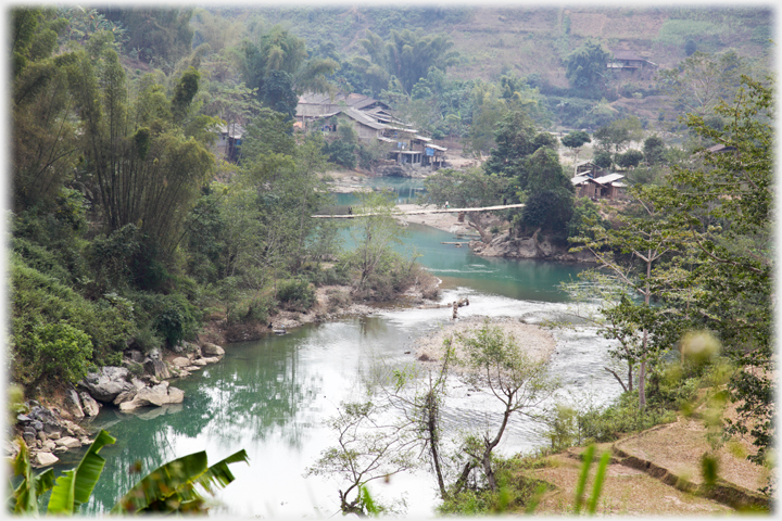 Suspension bridge by village.