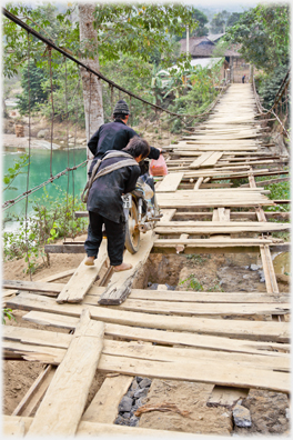 Motorbike on broken bridge.