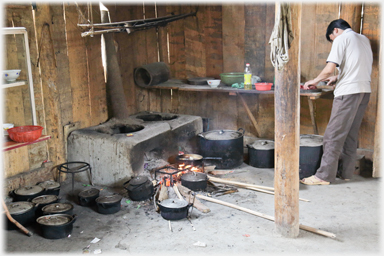 Man preparing food in kitchen.