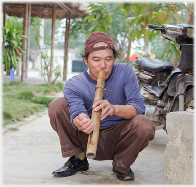 Man smooking water pipe.