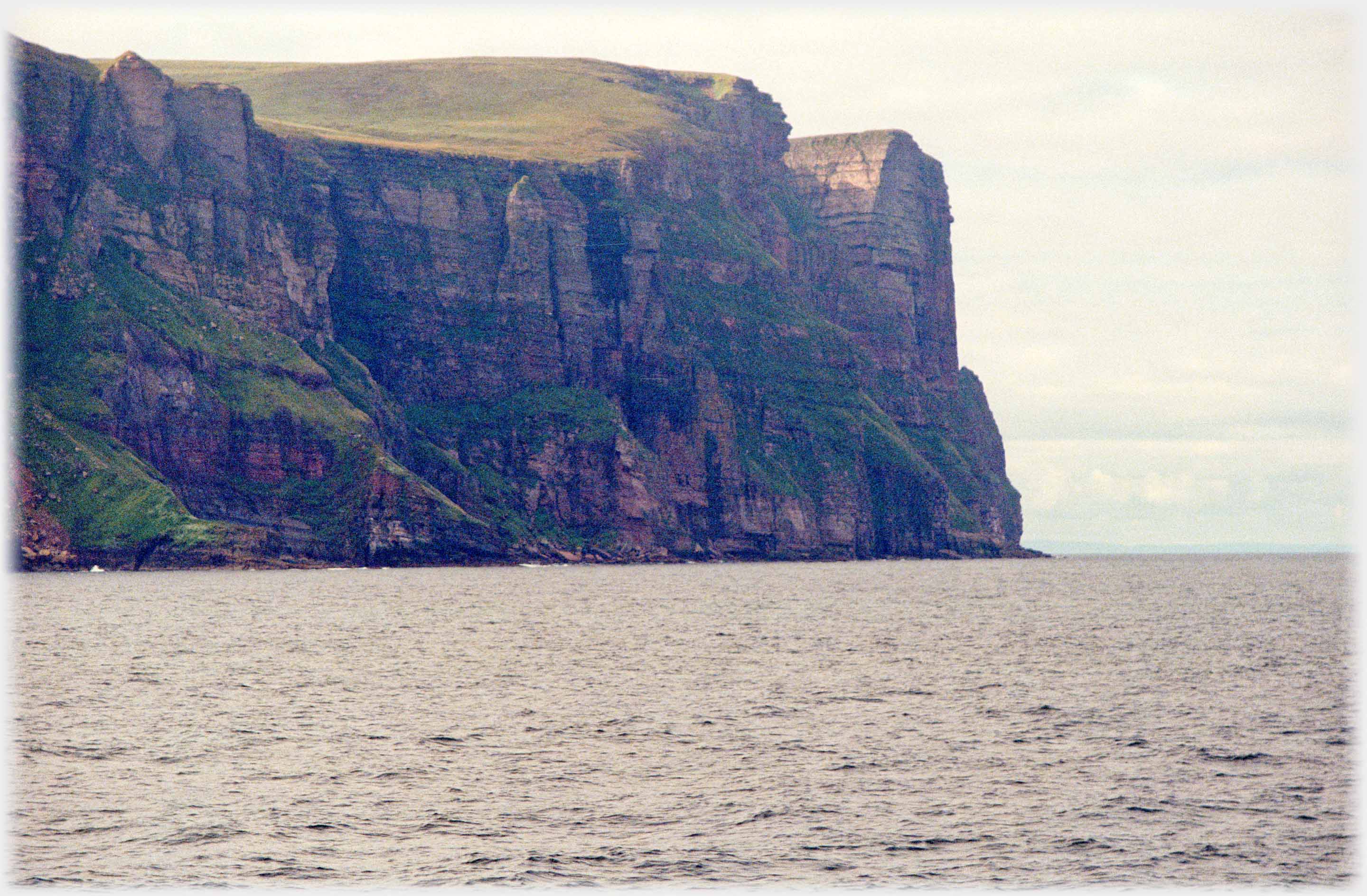 Passing the cliffs which are seen rising impressively ahead.