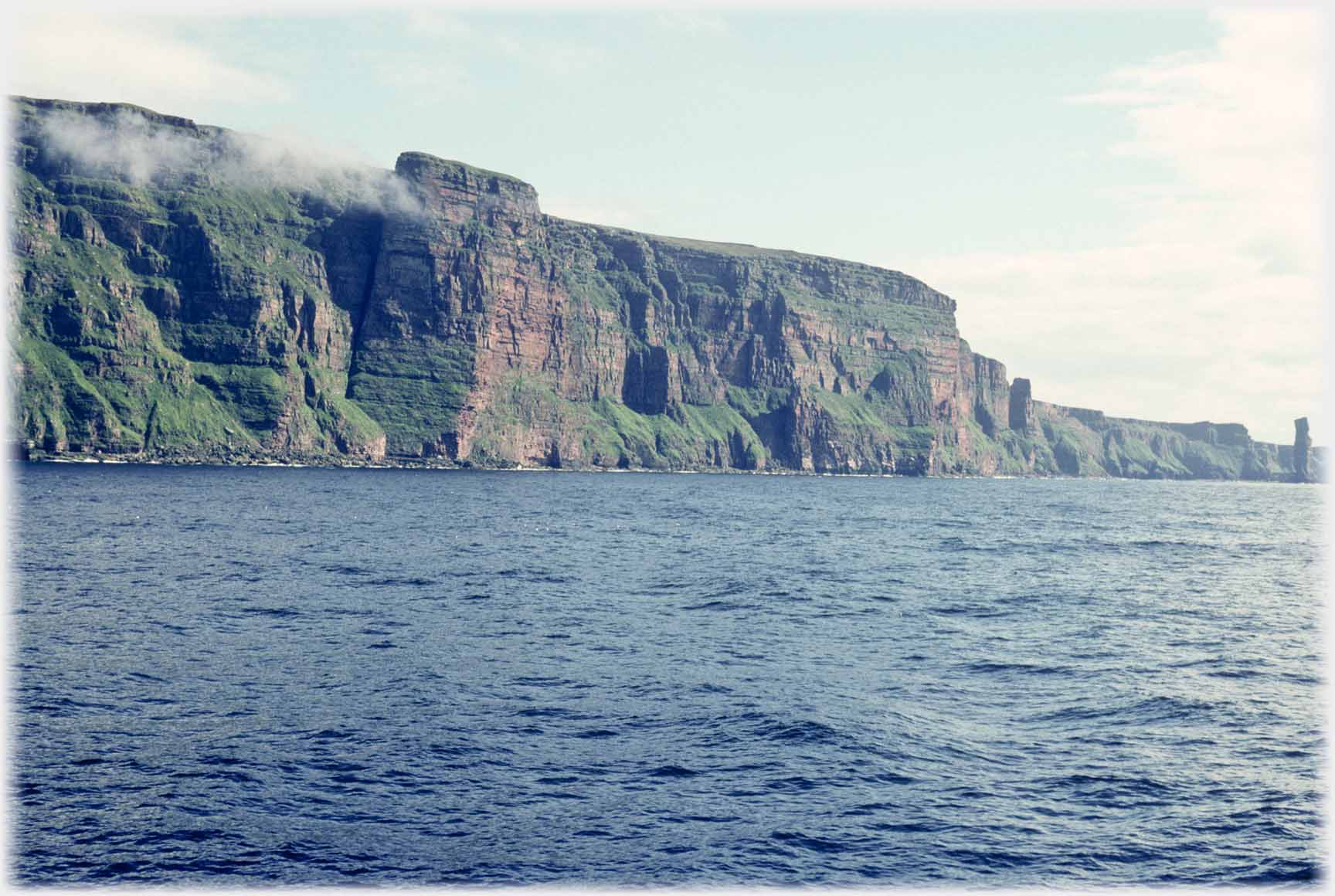 Looking along the length of the cliffs with the Old Man of Hoy at the end of the range.