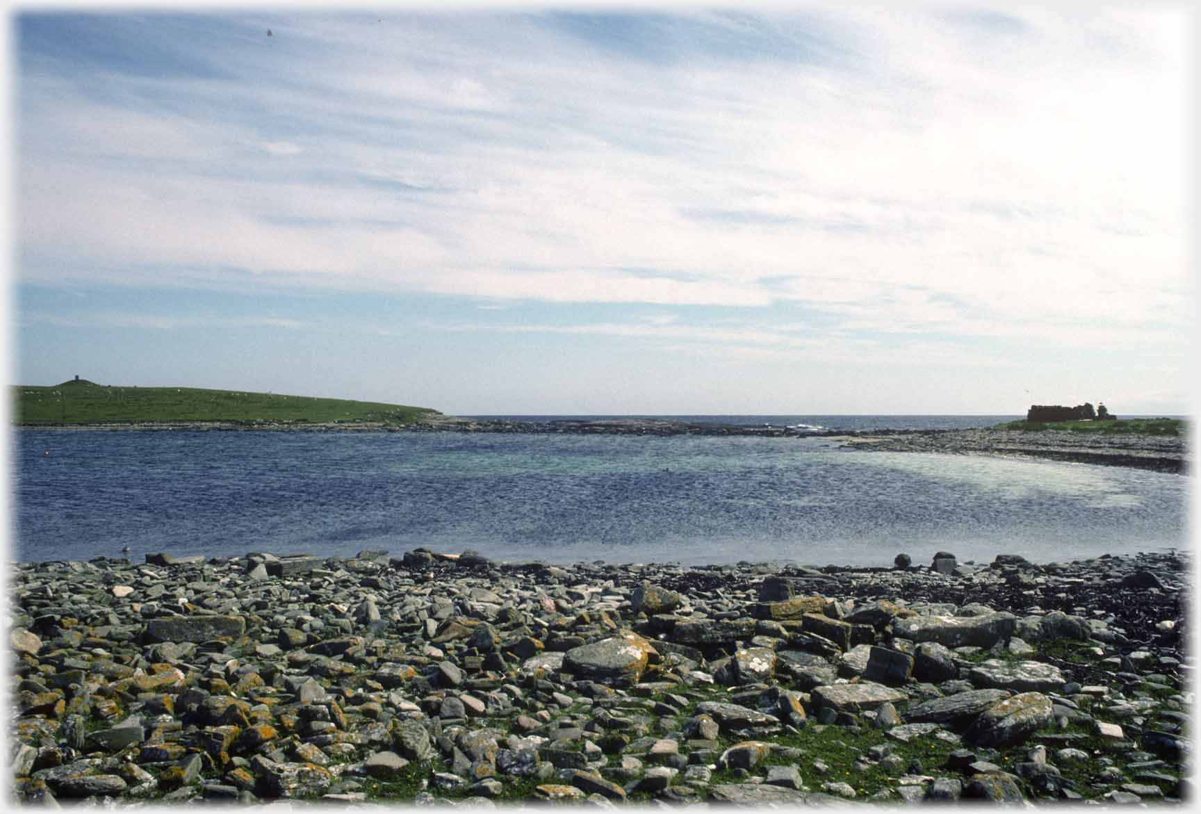 Rocky shore around lagoon.