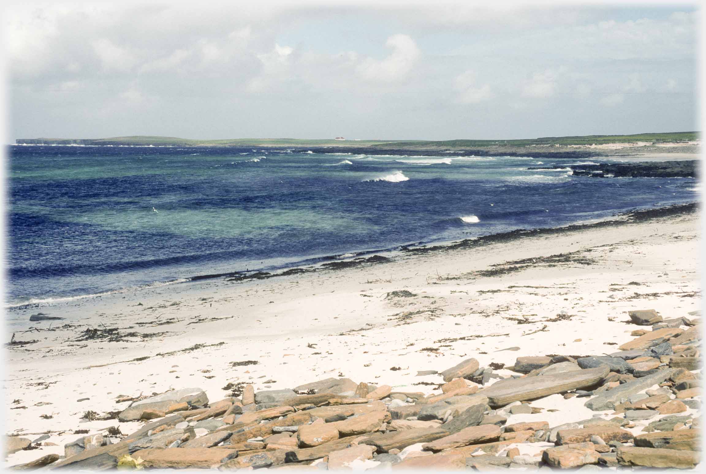 Bay with small waves on sea that is completely clear.