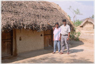 Thavamani and nephew by their house.