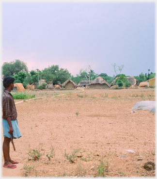 Man looking at village.