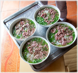 Four bowls of pho.