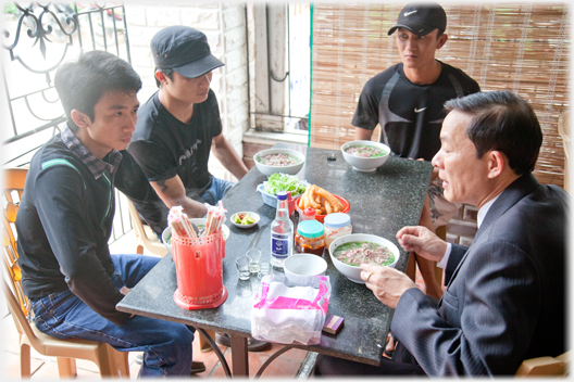 Four people with pho.