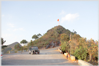 The hill and flag that mark Vietnam's northern tip.