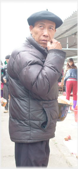 Man in beret with toothpick.