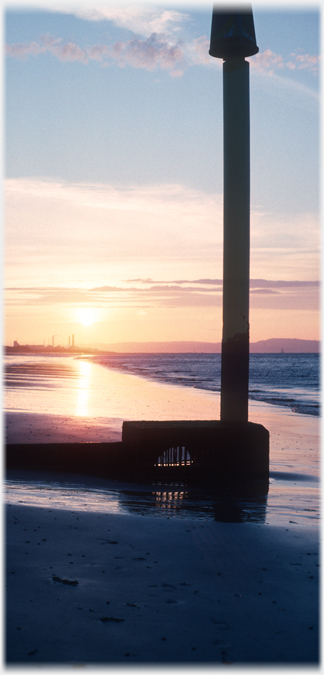 A fifteen foot high vent out of water at low tide.