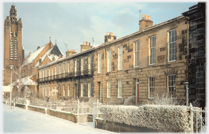 Row of houses in snow.