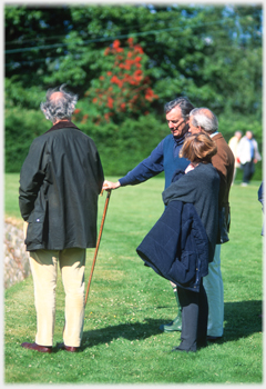 Charles Jencks standing with three people.