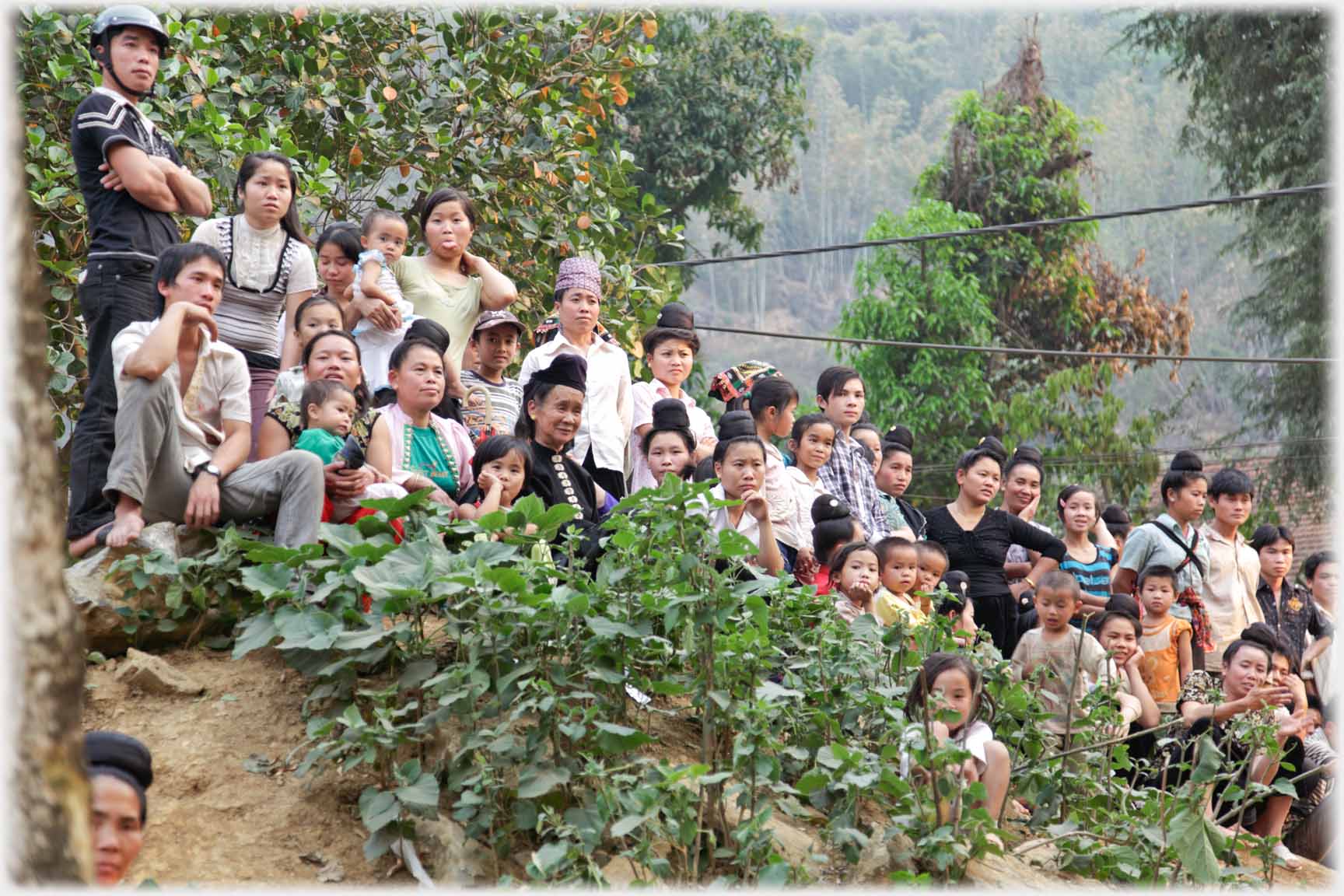 Villagers on sloping ground.