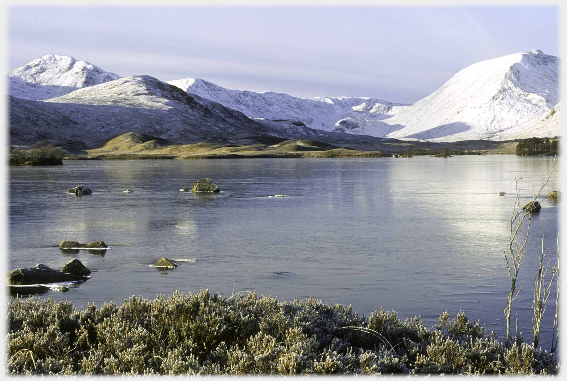 Loch with hills beyond.