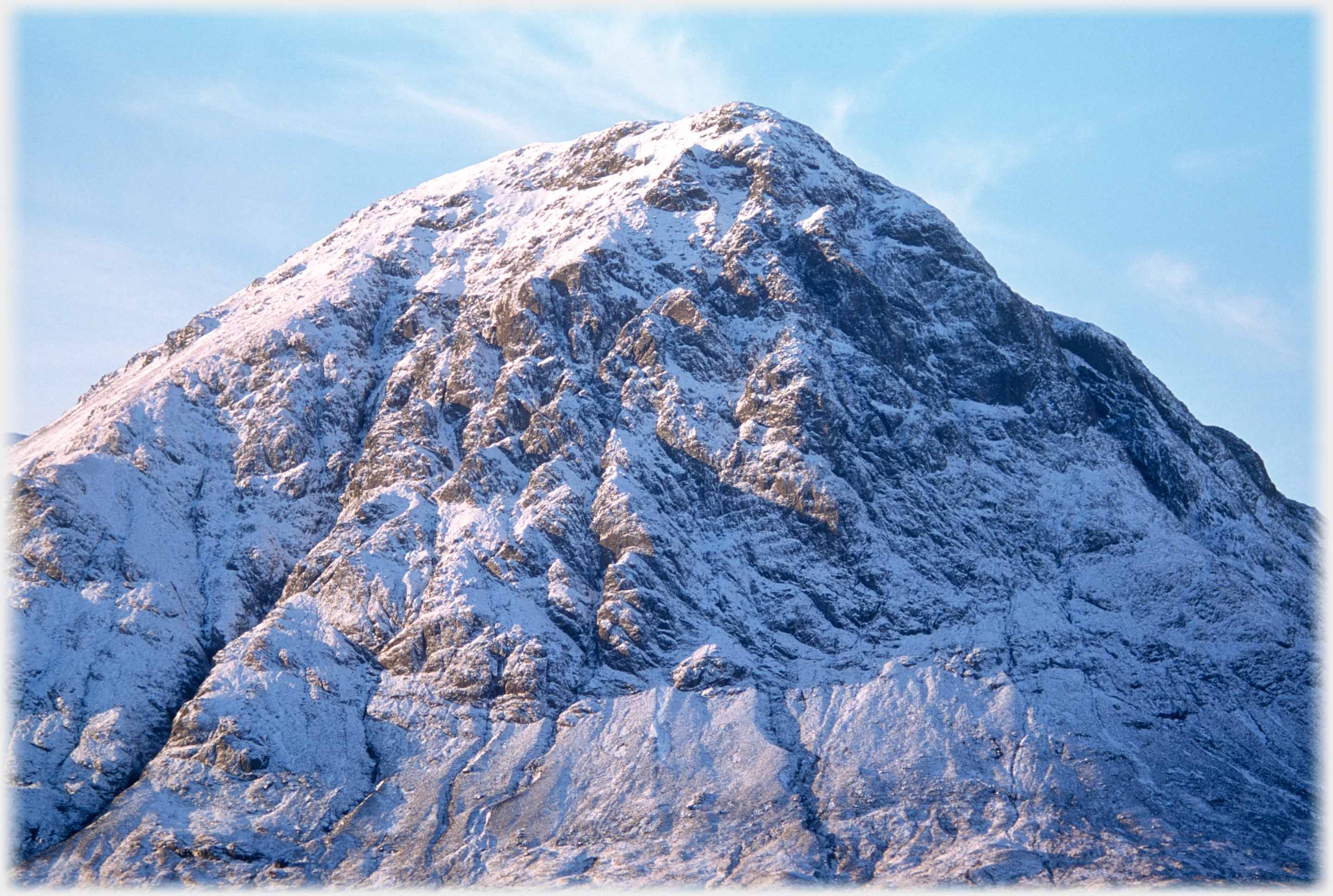 Close-up of highly textured hill with snow emphasising moulding.