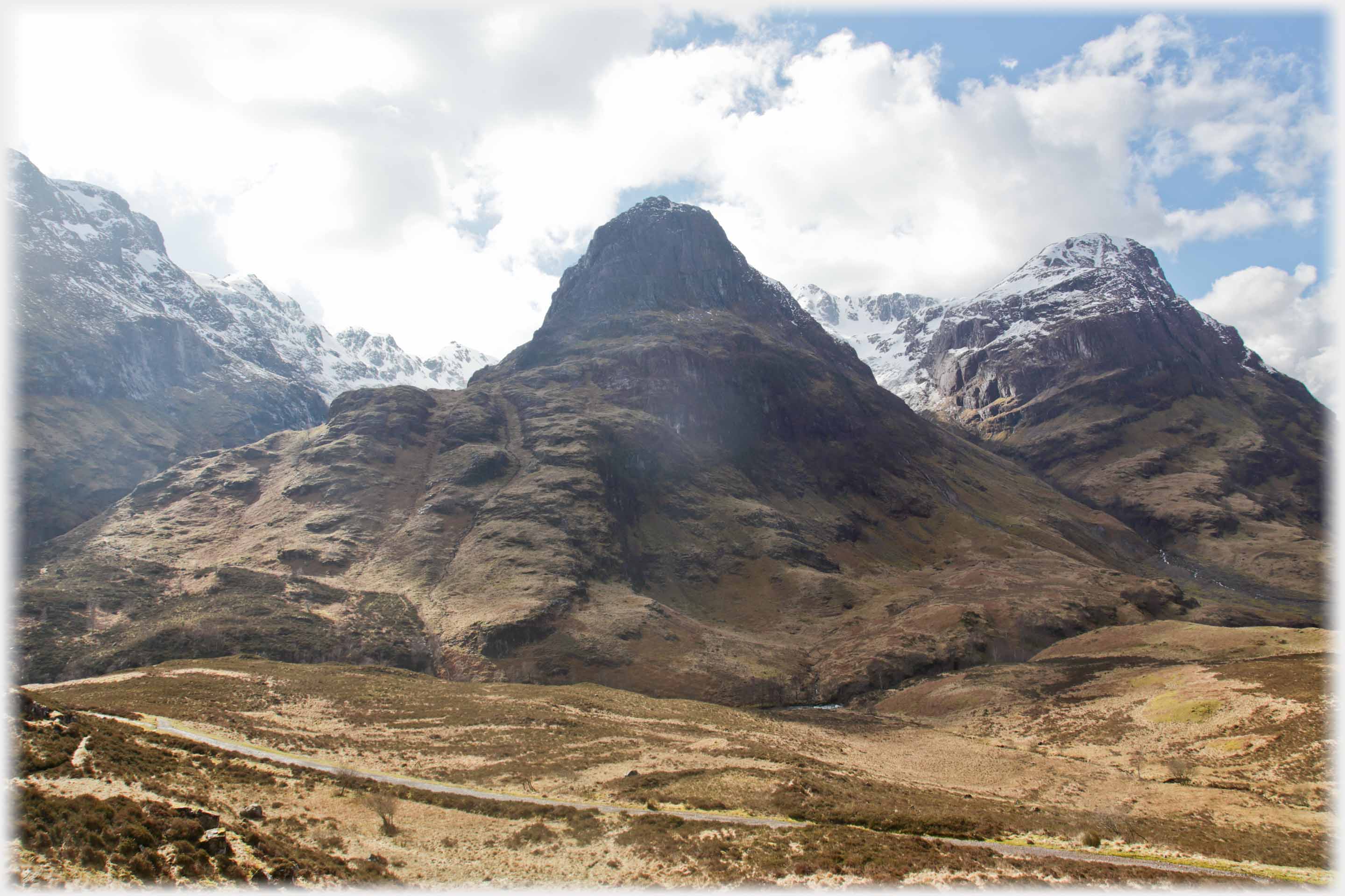 Conical hill in shadow.