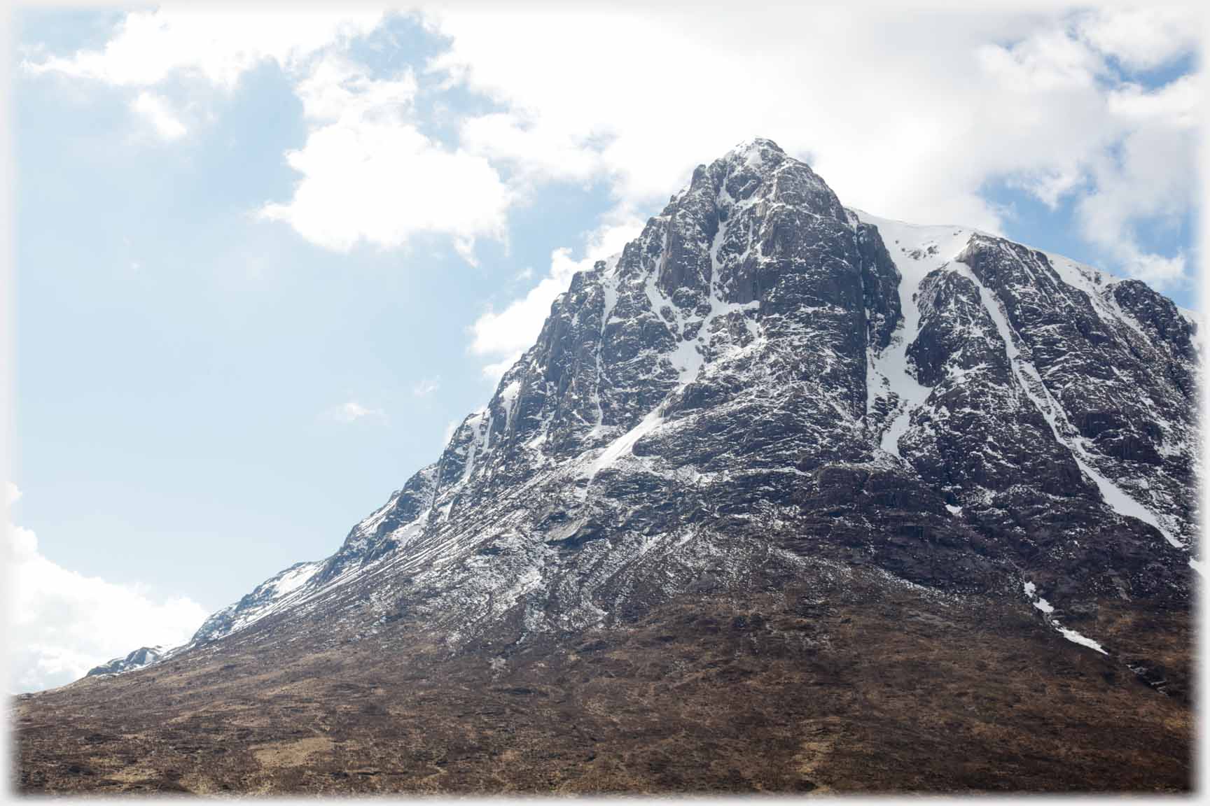 Sharp edged hill with snow veins.