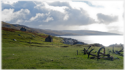 Anchors near, two houses further off, and sea to the right.