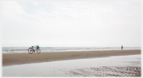 Bike parked on the beach.