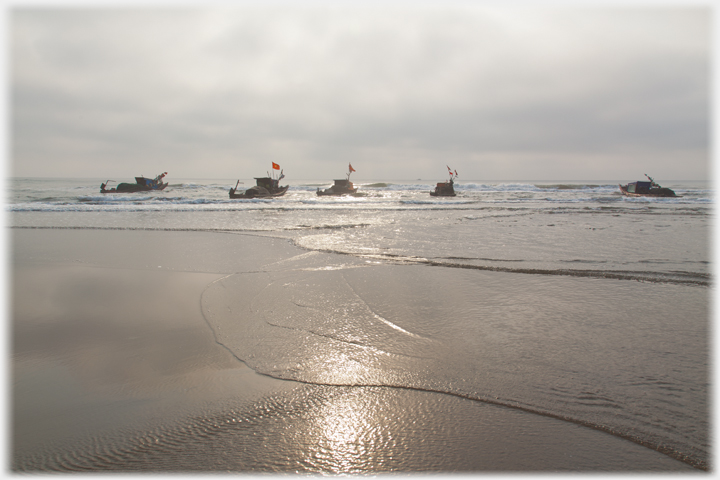 Five boats at Tinh Gia Beach