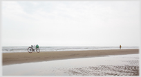Beach with bicycle standing.